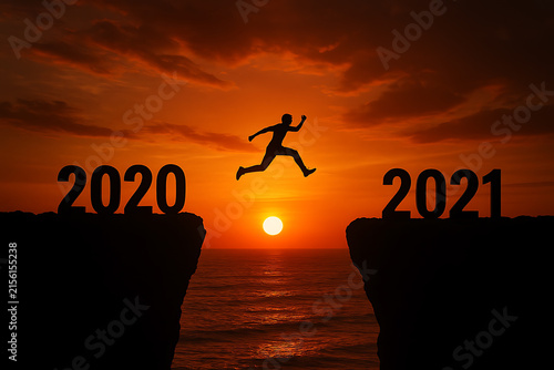 Silhouette Of Person Jumping Between Years Two Thousand Twenty And Two Thousand Twenty one