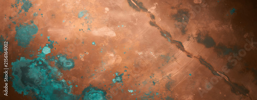 Detailed close-up photo of aged copper metal surface with natural green patina oxidation and weathered texture background