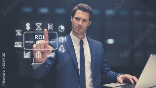 Businessman touching digital ROI interface for financial growth and business strategy
