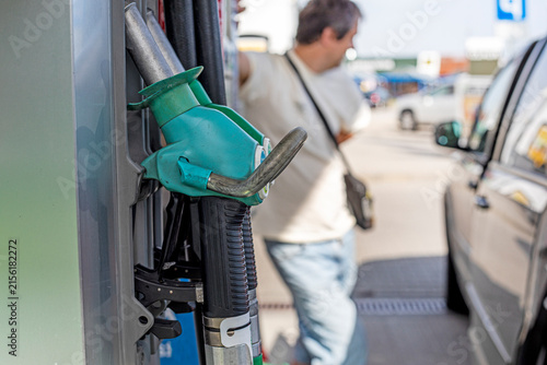 Obraz na płótnie refueling a LPG car with a nozzle at a self-service gas station during the day