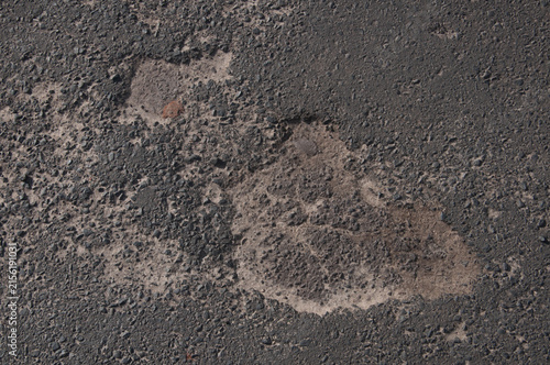 The surface of the asphalt as a background. Close-up.