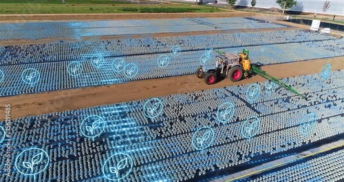 Modern Agricultural Tractor in Smart Farming Field with Precision GPS Guidance. Smart Farming Tractor Working in Precision Agriculture Nursery with Digital Farming Technology.