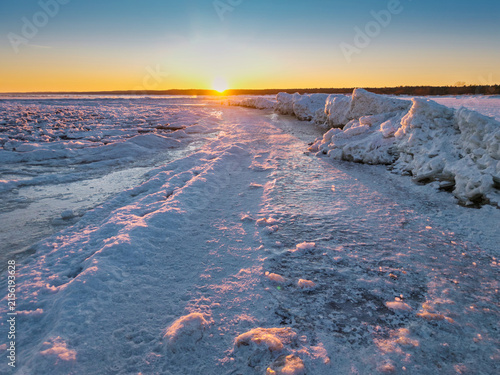 Ice toros on the Baltic Sea beach in Mikoszewo at sunrise. Poland