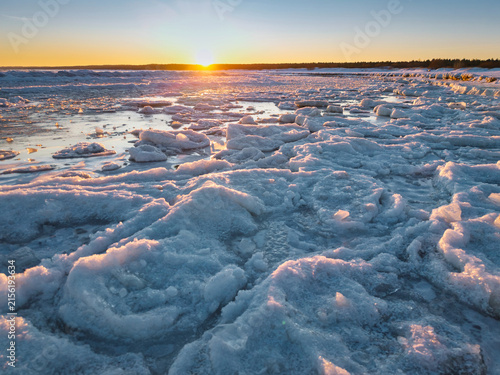 Ice toros on the Baltic Sea beach in Mikoszewo at sunrise. Poland