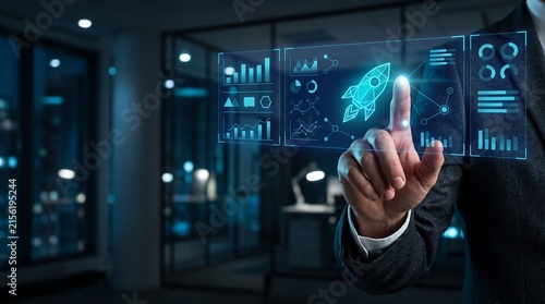 Business startup launch with digital data interface and rocket icon pointing to growth in futuristic office background for financial analytics and technology innovation