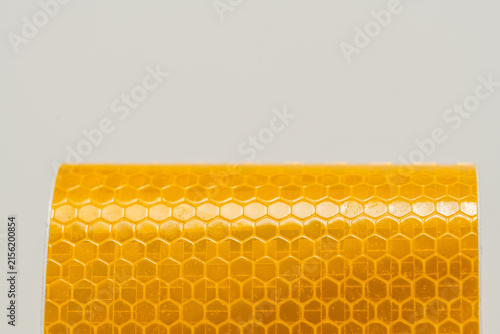 Yellow and Amber Reflective Safety Tape Patterns Close-Up