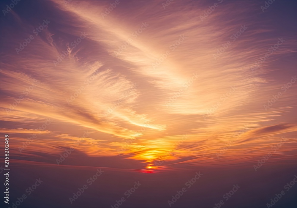 Fototapeta premium Dramatic Sunset Sky with Wispy Clouds and Golden Sun Rays.
