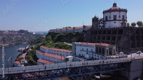 Porto, Portugal cityscape with the Douro River and historic bridges, featuring the Infante Bridge and Maria Pia Bridge, surrounded by traditional Portuguese architecture and scenic urban landscape.