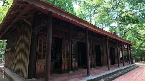 Reconstruction of a traditional Southern Vietnamese house in the forest of Cu Chi Tunnels. Historic site near Ho Chi Minh City.