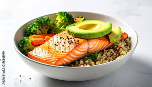Healthy salmon bowl with quinoa, avocado, and broccoli.