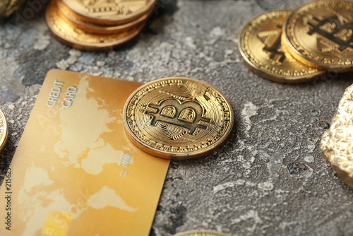 Golden bitcoins with credit card on grunge background