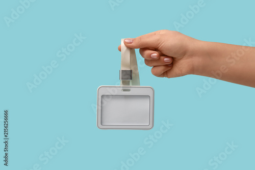Female hand with blank badg...