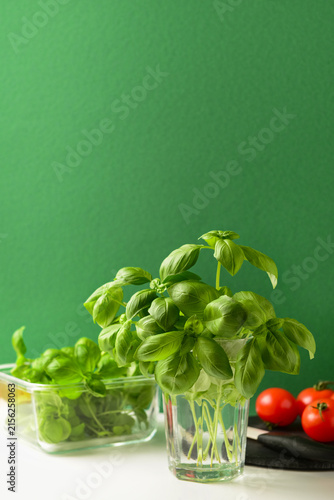 Glass of fresh green basil ...