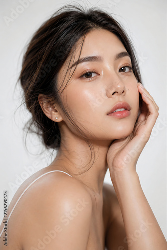 beautiful Asian woman with clean glowing skin and natural makeup