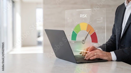 Operational risk monitoring and hazard warning system concept shown by a corporate executive typing at a desk