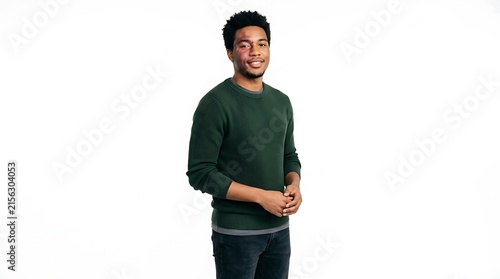 Young man with bruise on face smiling confidently against white background