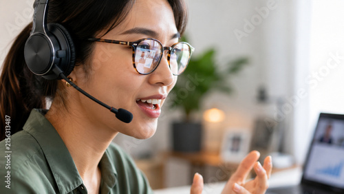 Woman wearing headset and speaking during a video call
