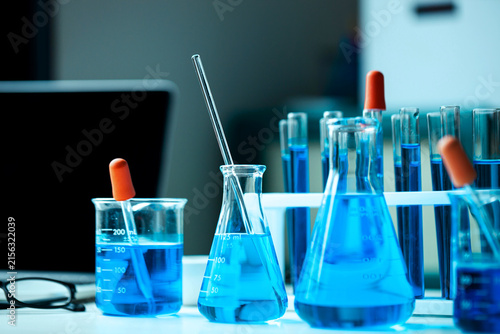 Blue Chemical Solutions in Laboratory Beakers and Flasks for Scientific Research, Chemistry Experiments, Pharmaceutical Testing and Biotechnology