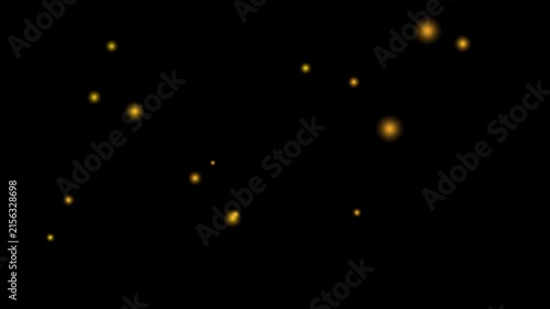 Golden glowing particles floating on black background for motion graphics and overlays. Neon golden color particle 
