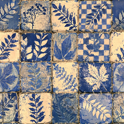Hand-carved wooden stamps, botanical ink impressions, carved leaves, small rollers, paint smudges and thread-bound stamp blocks arranged into a seamless artisan printmaking wallpaper