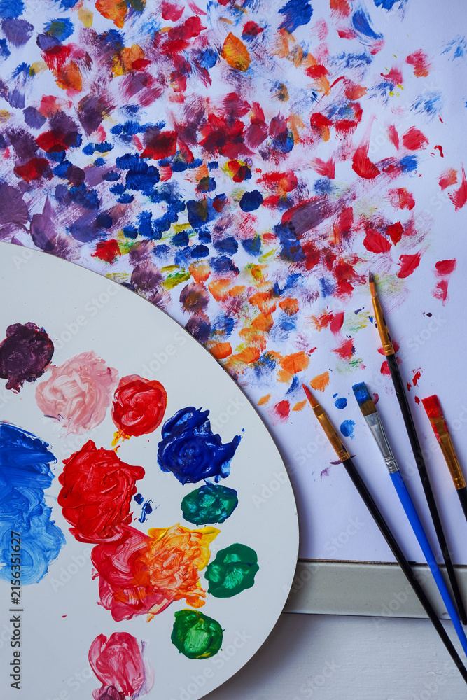 Fototapeta premium palette with paints and brushes