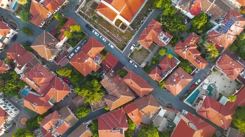 Antalya, Turkey. Kesik Minaret and Sehzade Korkut Mosque, a restored stone minaret rising above terracotta rooftops in Kaleici Old Town, aerial drone view in morning light. Aerial View, HEAD OVER SHO