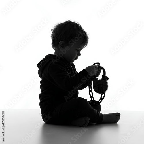 Silhouette of a Child Playing with Toy Camera.