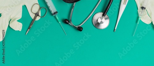 Medical Instruments on Green Background with Copy Space