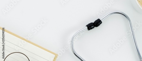 Stethoscope with Notebook and Glasses on White Background