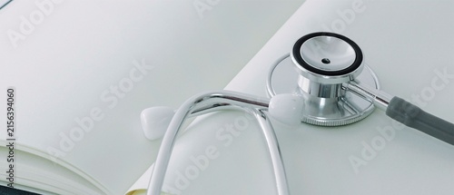 Stethoscope on Notebook with White Background and Copy Space