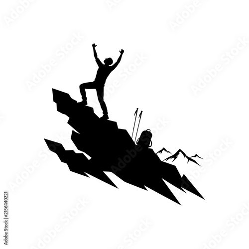 Silhouette of a hiker standing on a mountain peak celebrating success and achievement.
