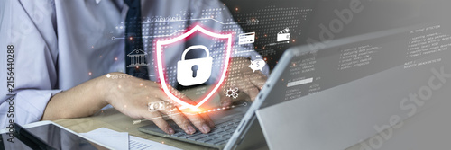 Cybersecurity concept featuring secure digital technology, a glowing shield and lock interface on a laptop. , online privacy, network security, threat detection and secure business operations.