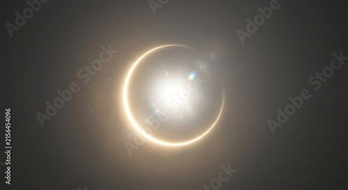 Abstract total solar eclipse with glowing diamond ring effect and golden lens flare background