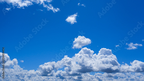 Cuadro en lienzo White clumps of clouds in the summer blue sky, clean and fluffy, are perfect for the background