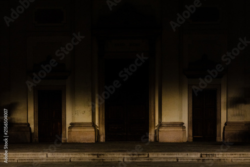 Historic church Facade Illuminated by Warm Light at Night
