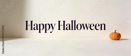 Happy Halloween text with a small pumpkin on a light background.