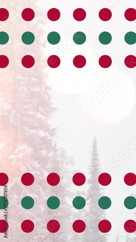 Animation of red and green spots at christmas over fir trees