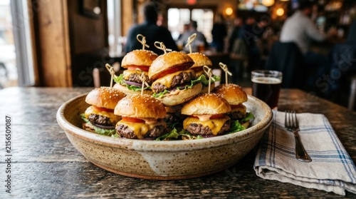 mini cheeseburgers served together in rustic ceramic food bowl container