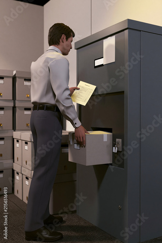 Businessman organizing files in a storage cabinet
