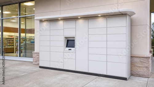 Modern Delivery Locker System Outside Retail Store with Touchscreen Interface