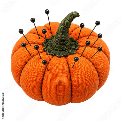Orange pumpkin pin cushion with black sewing needles