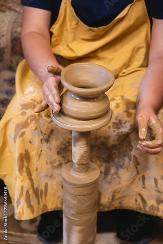 Artisan shaping clay on a pottery wheel in Avanos, Cappadocia, Turkey