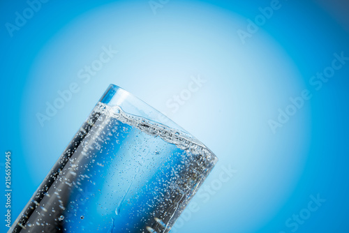 Bild auf Leinwand Clear drinking carbonated water in a tall glass.