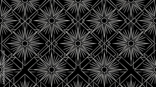 Art deco geometric pattern with silver sunbursts on black background