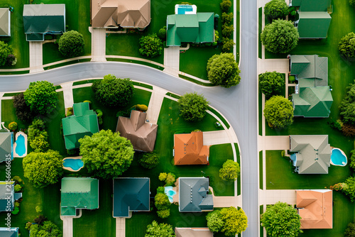 Aerial View of Upscale American Suburban Neighborhood with Homes and Pools