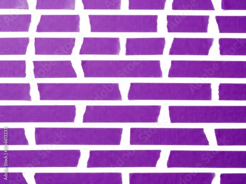Scattered pieces of vibrant purple masking tape on a clean white background, abstract pattern
