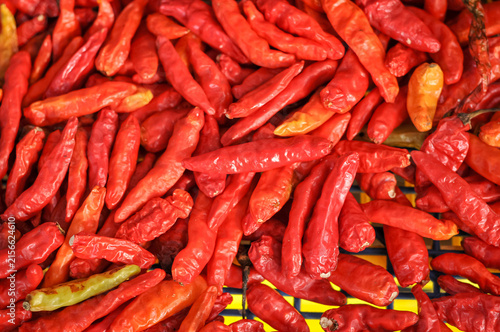 Obraz na plátně red chili peppers (such as red bird's eye chilies or curly red chilies) that are frequently used as a kitchen spice