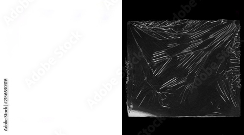 Transparent plastic wrap texture on black background, wrinkled cellophane overlay, glossy polyethylene film for packaging mockups