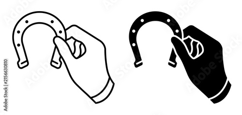 Linear icon. Hand of superstitious person holds horseshoe shaped talisman amulet. Simple black and white icon isolated on a white background
