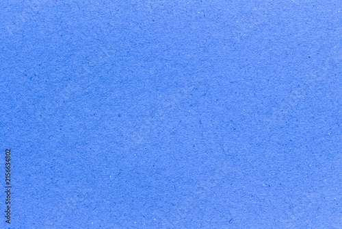 blue paper background texture light rough textured spotted blank copy space background in blue